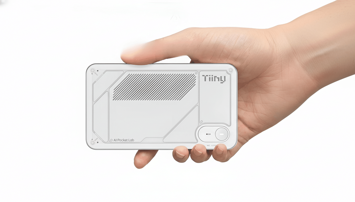 A hand holding a white Tiiny device, resized to a 16:9 aspect ratio with the original background maintained.