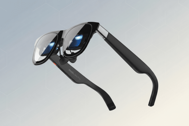 A pair of black XREAL One Pro smart glasses with reflective lenses, presented on a professional flat design background with soft patterns and gradients.