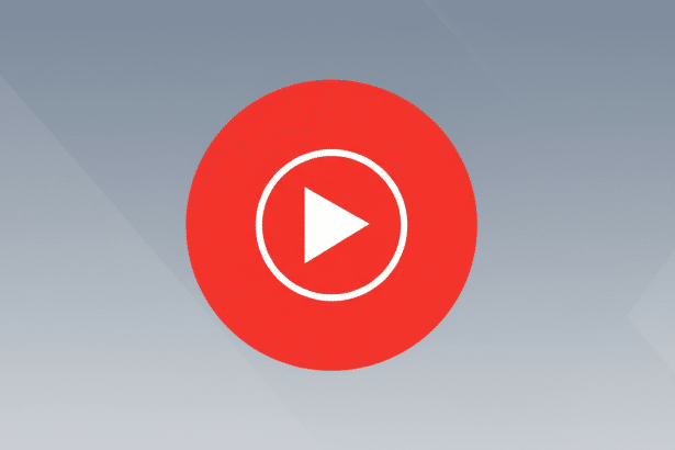 A 16:9 aspect ratio image featuring the YouTube Music logo, a white play button icon within a white circle, centered on a red circular background. The background is a professional flat design with a soft gray gradient.
