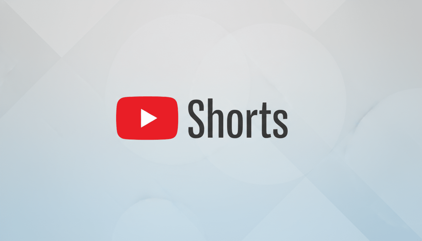 The YouTube Shorts logo, featuring a red play button icon next to the word Shorts in dark gray, centered on a professional light gray background with subtle geometric patterns.