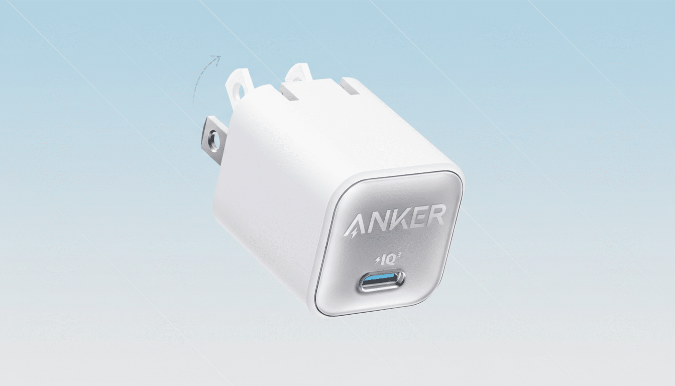 A white Anker wall charger with a USB-C port and foldable prongs, set against a professional light blue gradient background.
