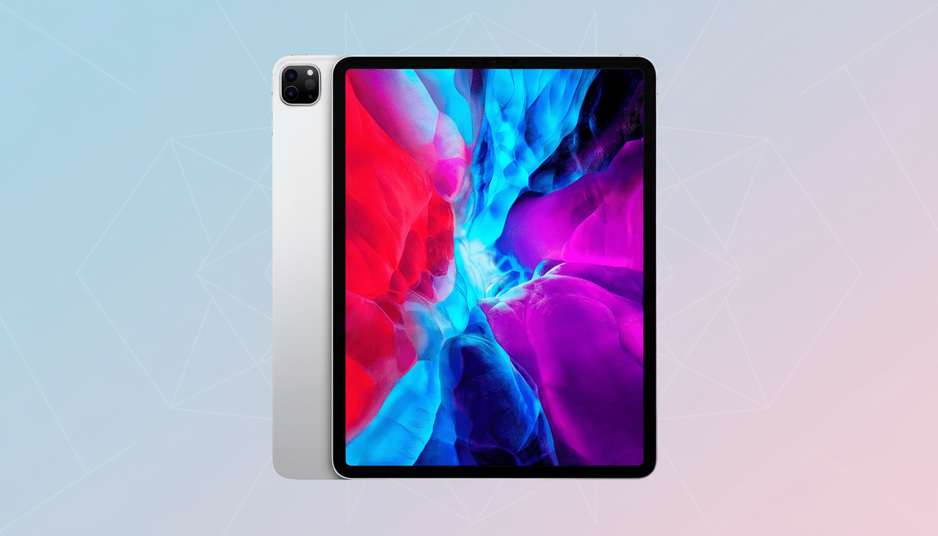 A silver iPad Pro displayed at a slight angle, with its screen showing a vibrant abstract wallpaper of red, blue, and purple hues. The background is a soft gradient of light blue and pink with subtle geometric patterns.