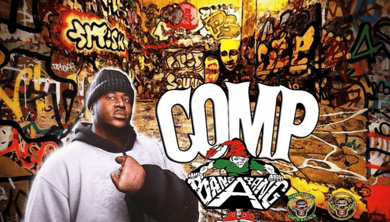 A man in a beanie and hoodie stands in front of a graffiti-covered wall, with the word COMP and a GANG BANG logo with a gnome in the foreground.