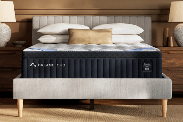A DreamCloud Premier mattress on a bed frame in a bedroom setting.