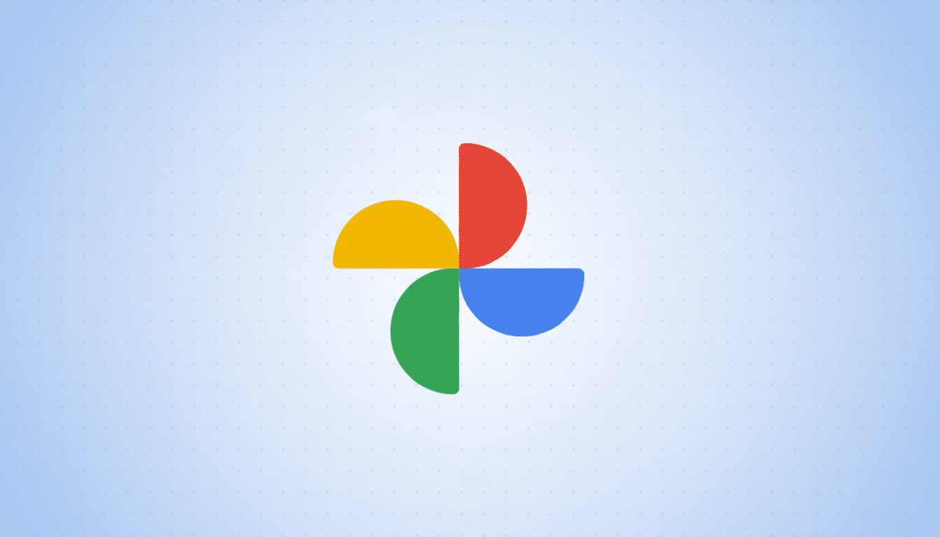 The Google Photos logo, consisting of four colorful, pinwheel-like shapes (red, yellow, green, and blue), centered on a light blue background with a subtle dotted pattern.