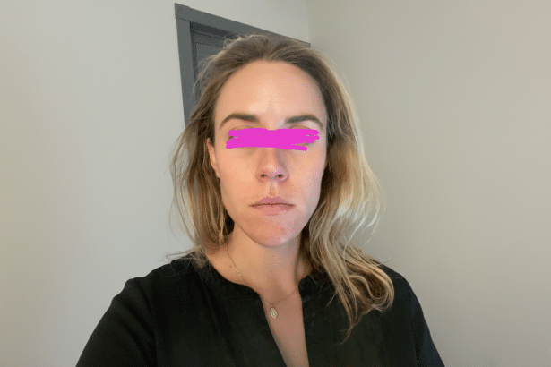 A woman with blonde hair and a black shirt, with a pink bar over her eyes, resized to a 16:9 aspect ratio.