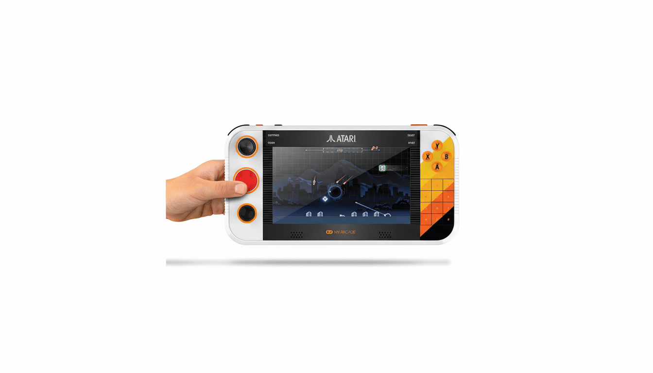A hand holding a white and orange Atari handheld gaming console, displaying a game on its screen, set against a white background.