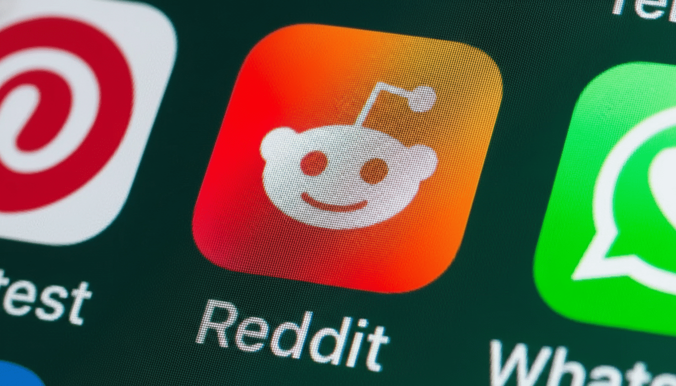 The Reddit app icon, featuring the white Snoo alien logo on a red and orange gradient background, displayed on a screen with other app icons.