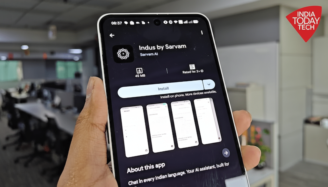 A hand holding a smartphone displaying the Indus by Sarvam app page on the Google Play Store, with an office background.