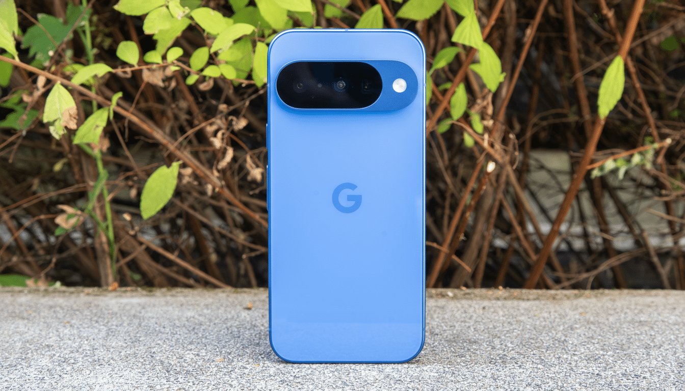 A blue Google Pixel phone is shown in a 16:9 aspect ratio, maintaining its original background of green leaves and brown branches.
