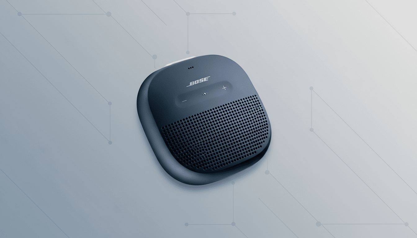A dark blue Bose portable speaker is centered on a light gray background with subtle geometric patterns.