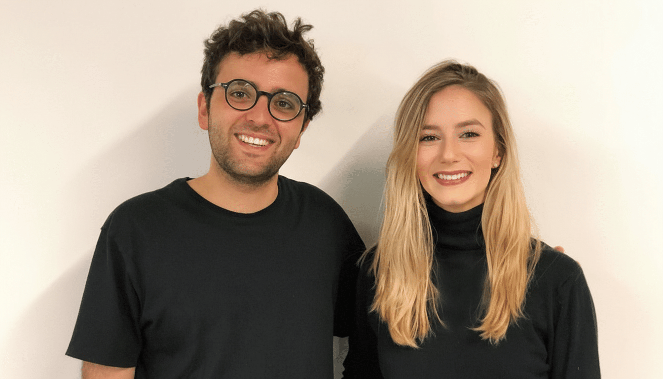 A man and a woman smiling, resized to a 16:9 aspect ratio with the original background maintained.
