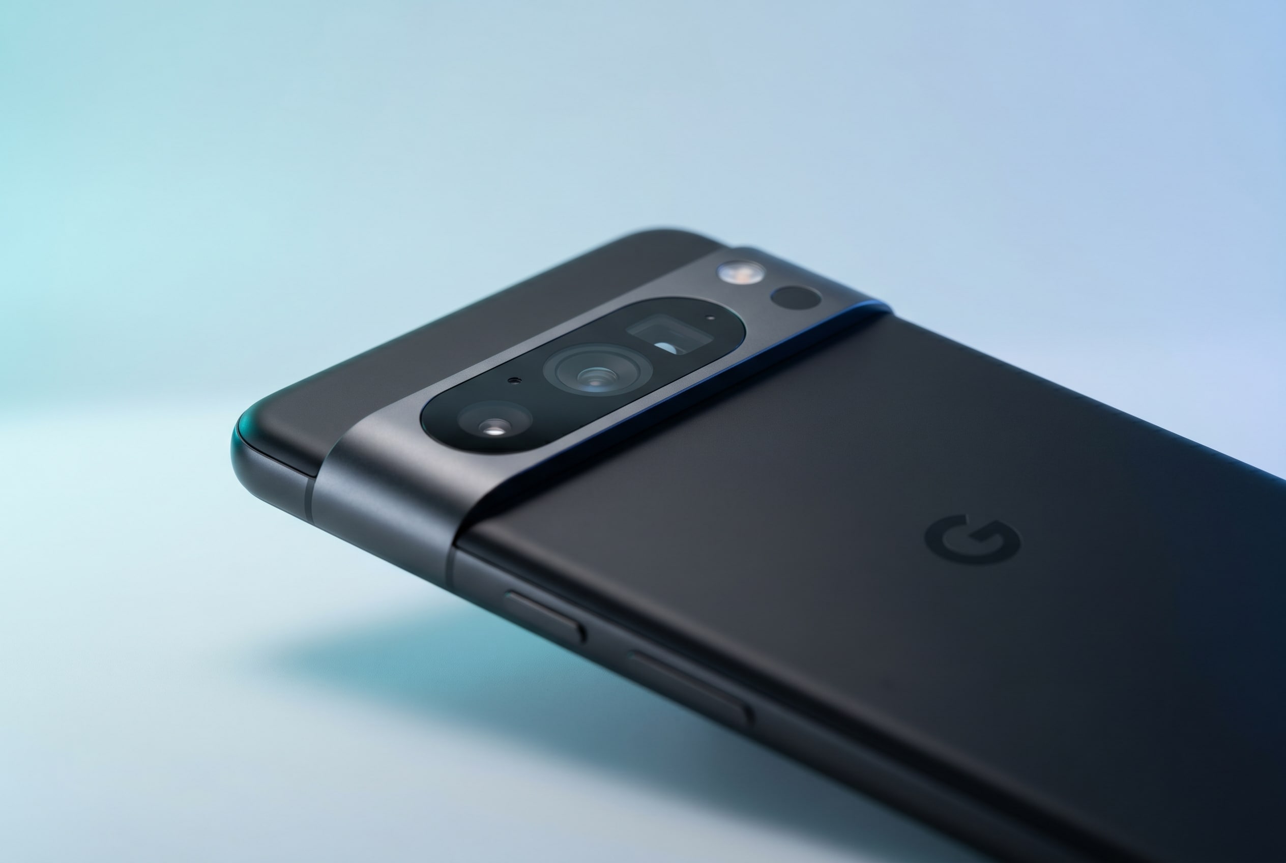 Google Pixel 11 in Black with Blue Background