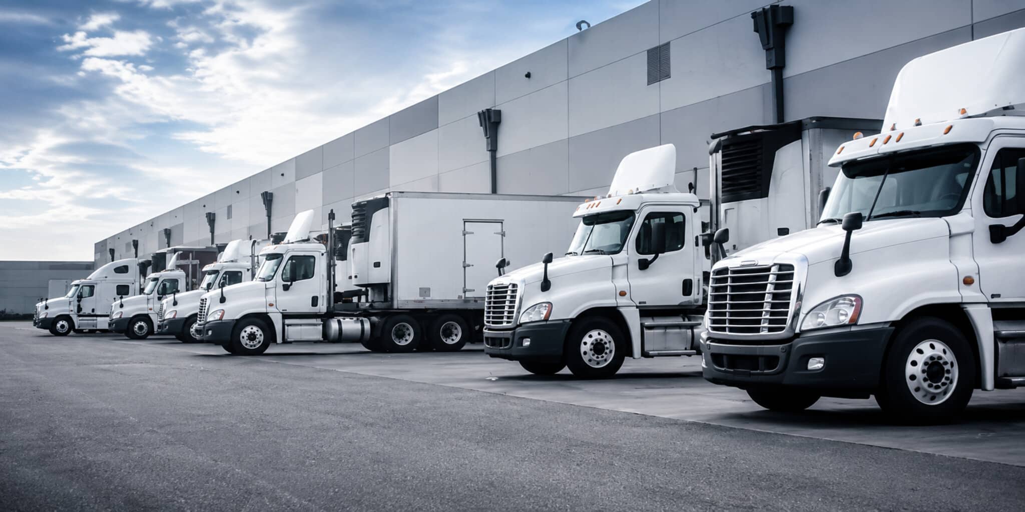 Fleet of trucks at warehouse